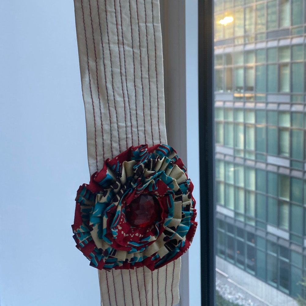 Custom jeweled belt with Ankara fabric design.